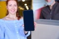 Red-haired woman has a mobile phone in her hands Royalty Free Stock Photo