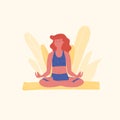 Red-haired woman is meditating in lotus pose or padmasana asana on yellow yoga mat. Yoga, stretching, pilates instructor. Physical