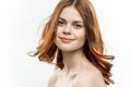 red-haired woman passionate look cropped view bare shoulders
