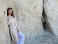 Red-haired woman posing rocks nature rest Royalty Free Stock Photo