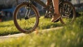 Red haired woman sitting on bicycle lying on grass in city park. Woman bike park Royalty Free Stock Photo