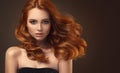 Red haired woman with voluminous, shiny and curly hairstyle.Flying hair. Royalty Free Stock Photo