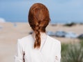 Red-haired woman white dress walk sand island Royalty Free Stock Photo