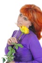 Red-haired woman with a yellow rose.