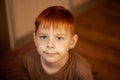 Red-haired young boy in thought, attention Royalty Free Stock Photo