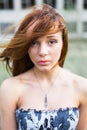 Red-haired young woman in floral dress Royalty Free Stock Photo