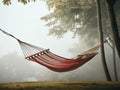 Red hammock in a misty forest. Quiet place to relax, take a break, meditate, have a nap, sleep, or dream. Generative AI