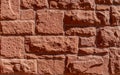 Red hand-made brick wall background. Abstract pattern with inequalities Royalty Free Stock Photo