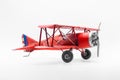 Red, miniature old biplane model scale Royalty Free Stock Photo