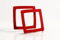 Red hand painted square frames overlapping pair with the top frame slightly elevated for a faint mirror reflection on white Royalty Free Stock Photo
