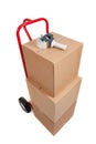 A red hand truck with boxes and a tape gun Royalty Free Stock Photo