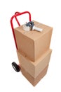 A red hand truck with boxes and a tape gun