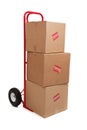 A red hand truck on white with boxes