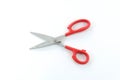 Red handle scissors in the open position Royalty Free Stock Photo