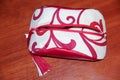 Red handmade cosmetic bag. Stylish cosmetics with your hands. We sew together. Capacious bag. Royalty Free Stock Photo