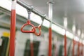 Red handrails in the subway train