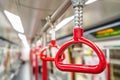 Red handrails in subway train