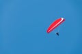 Red Hang Glider in a Deep Blue Sky Royalty Free Stock Photo