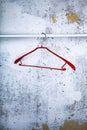 Red hanger on a gray wall Royalty Free Stock Photo