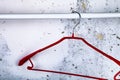 Red hanger on a gray wall Royalty Free Stock Photo