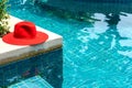 Red hat on the Blue water swimming pool Royalty Free Stock Photo
