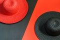 Red hat lady on the blacck background, black hat lady on the red background. Fashionable lady hats, lifestyle concept Royalty Free Stock Photo