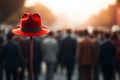 Red hat pops on pole, a standout in bustling crowd