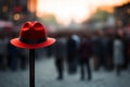 Red hat pops on pole, a standout in bustling crowd