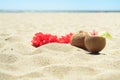 Red Hawaiian lei garland on the beach