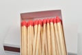 Red head matches in a white opened box on white background Royalty Free Stock Photo