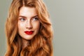 Red head woman with freckles and ginger hair. Natural redhead girl, beautiful female model face closeup Royalty Free Stock Photo