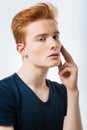 Red-headed man touching his forehead Royalty Free Stock Photo