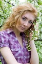 Red-headed womn under cherry tree Royalty Free Stock Photo