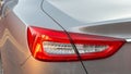 The red headlight of a modern sedan metallic car. Rear stop light. Premium LED sedan taillights. Royalty Free Stock Photo