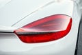 The red headlight of a new modern white color car. Rear stop light of prestige suv car. White premium city crossover Royalty Free Stock Photo