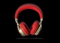 Red headphone and cable isolated on background..Headphones.Red headphone.Technology Royalty Free Stock Photo