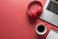 Red Headphones, Laptop, Coffee, and Notebook on a Pink Surface Royalty Free Stock Photo