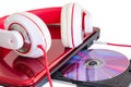 Red headphones and laptop with compact disk Royalty Free Stock Photo