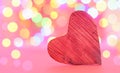 Heart on bulb pink colored background