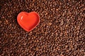 Red heart on a background of coffee beans. Love symbol, greeting card for valentine day. Good morning coffee drinker Royalty Free Stock Photo