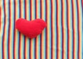 Red heart on a background of rainbow fabric. place for text. bright banner, concept. love. copy space Royalty Free Stock Photo