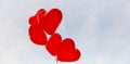 Red heart balloons on a background of sky. Royalty Free Stock Photo