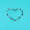 Red heart of barbed wire on a blue solid background. The concept of a broken heart or heart disease. Minimal concept Royalty Free Stock Photo