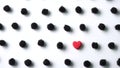 Red heart in black pom poms polka dot on white background Royalty Free Stock Photo