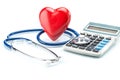 Red heart and calculator with stethoscope on white background Royalty Free Stock Photo