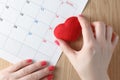 Red heart and calendar, love month