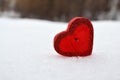 Red heart candle in the snow, a gift for loved ones Royalty Free Stock Photo
