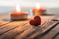 Red Heart with candle on wooden backdrop. Happy valentines day