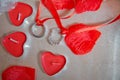 Red heart candles . Red rose petals . Gold wedding rings Royalty Free Stock Photo