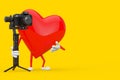 Red Heart Character Mascot with DSLR or Video Camera Gimbal Stabilization Tripod System. 3d Rendering